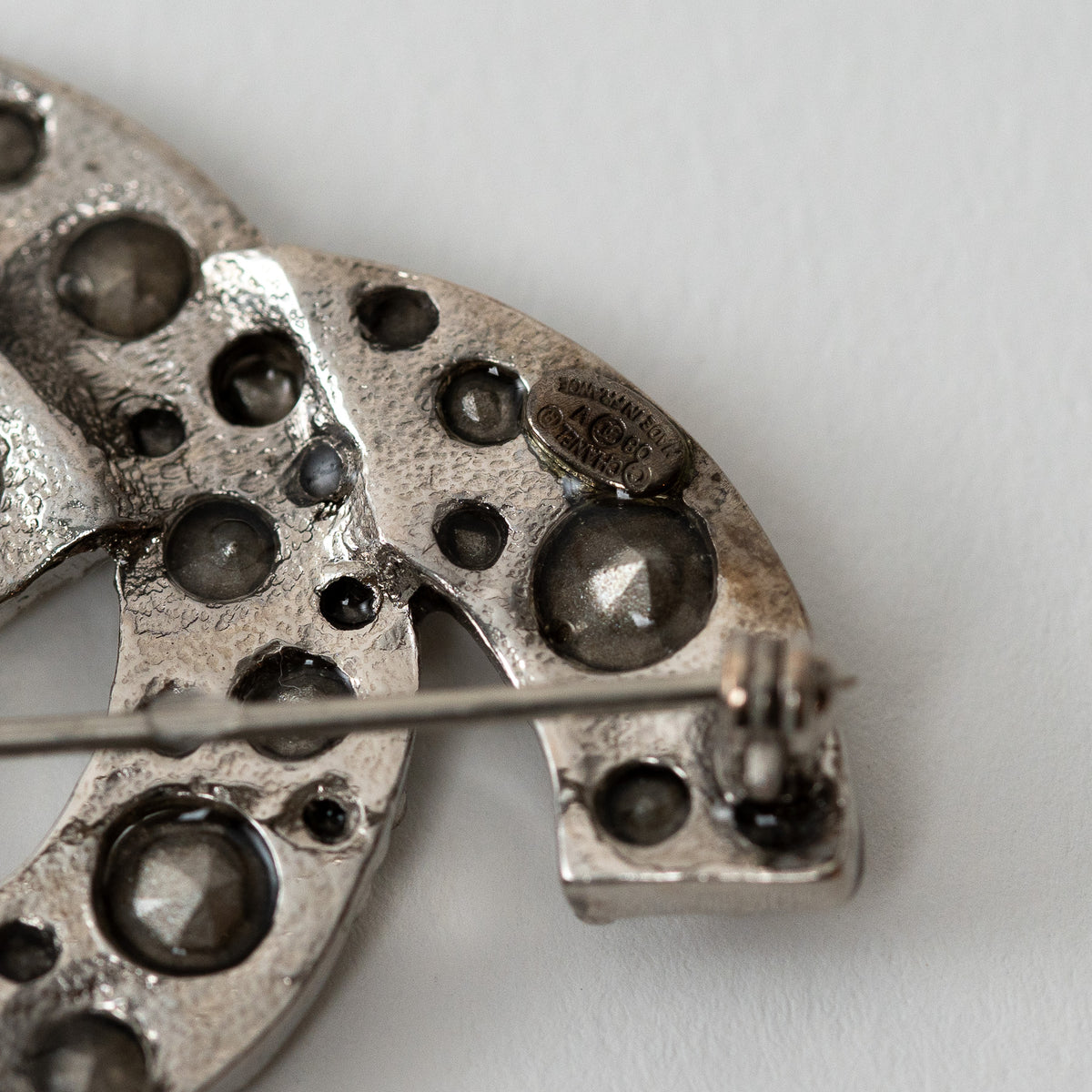 Pre-Loved Chanel™ Silver Tone Crystal Embellished Brooch