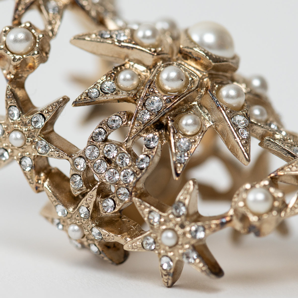 Pre-Loved Chanel™ Gold Tone Faux Pearl and Crystal Embellished Multi Star Ring Size 7