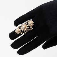 Pre-Loved Chanel™ Gold Tone Faux Pearl and Crystal Embellished Multi Star Ring on hand
