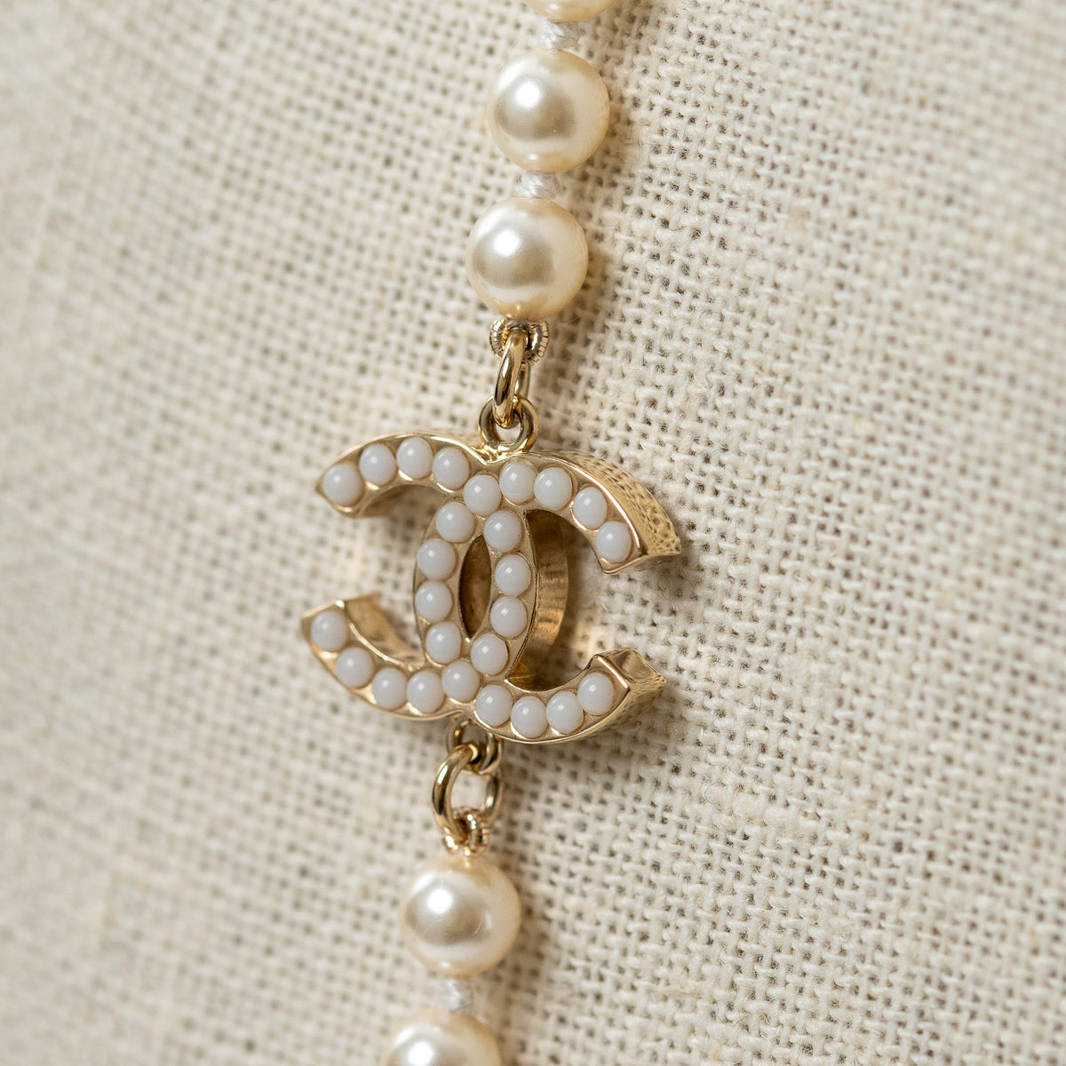 Pre-Loved Chanel™ Faux Pearl Necklace with Gold Tone Logo Links Embellished with Pearls
