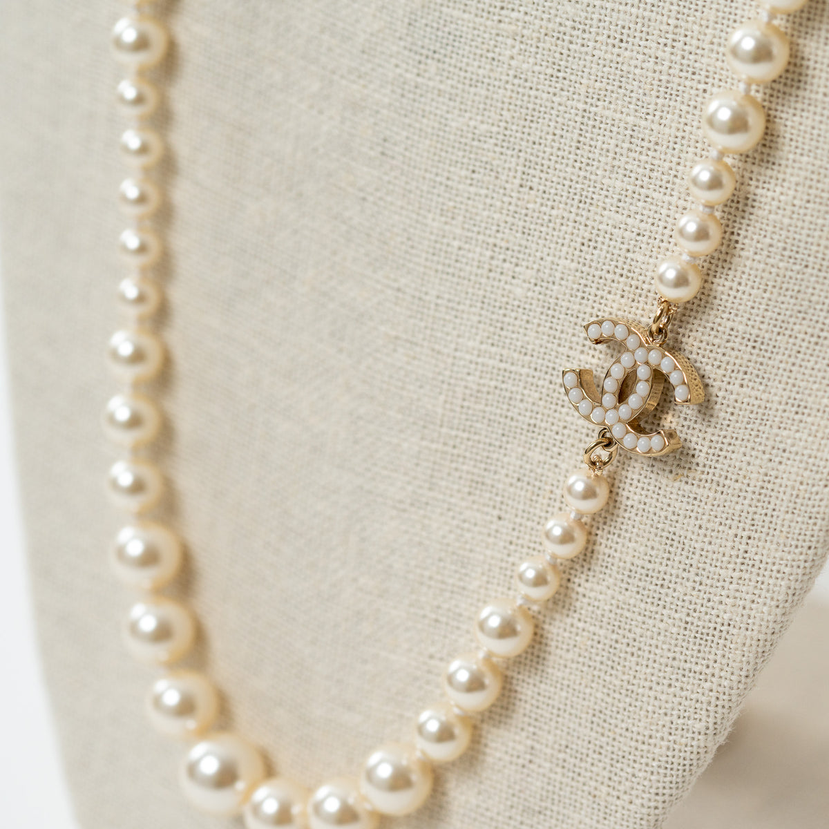 Pre-Loved Chanel™ Faux Pearl Necklace with Gold Tone Logo Links Embellished with Pearls