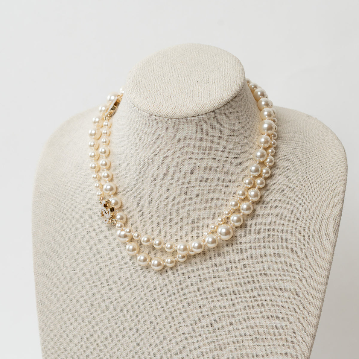 Pre-Loved Chanel™ Faux Pearl Necklace with Gold Tone Logo Links Embellished with Pearls