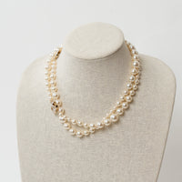 Pre-Loved Chanel™ Faux Pearl Necklace with Gold Tone Logo Links Embellished with Pearls