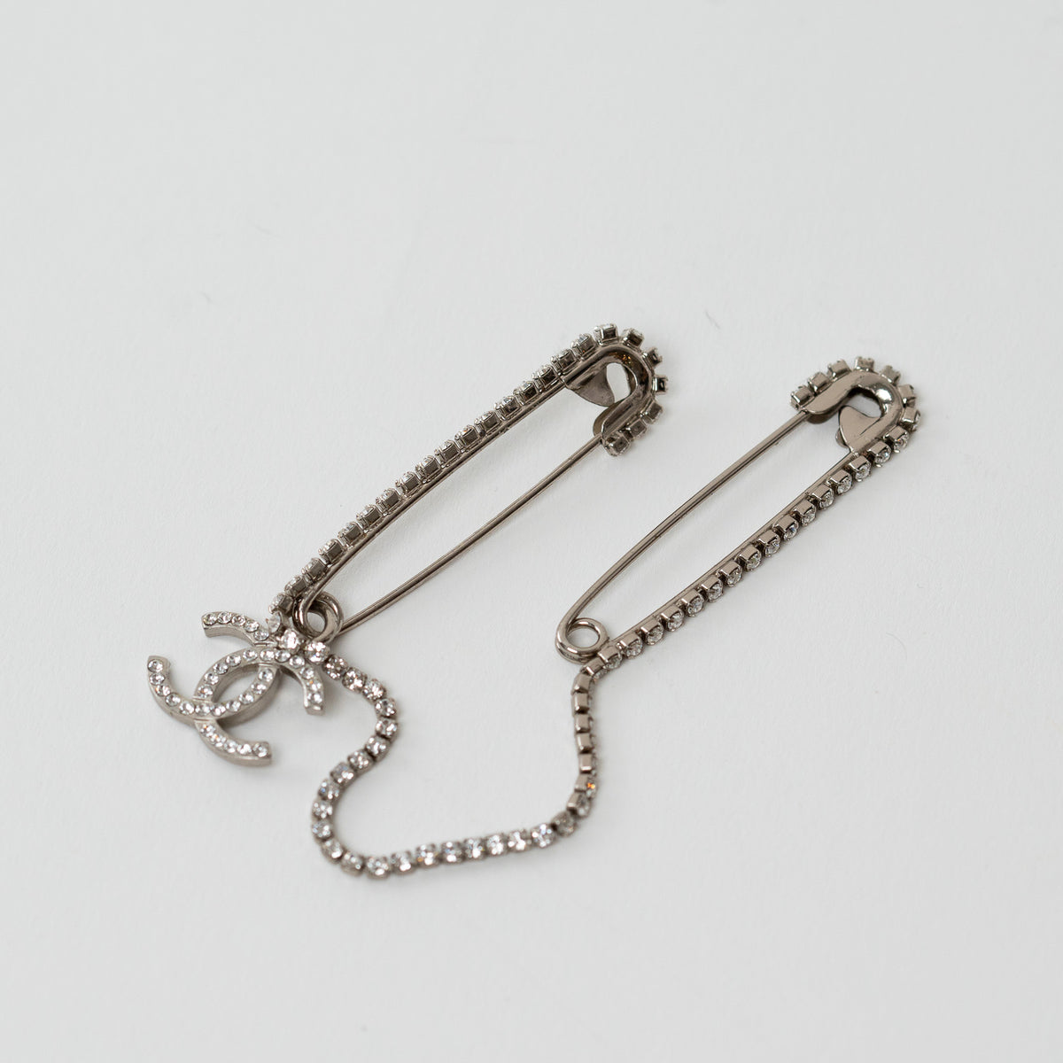 Pre-Loved Chanel™ Silver Tone Crystal Embellished Safety Pin Double Brooch