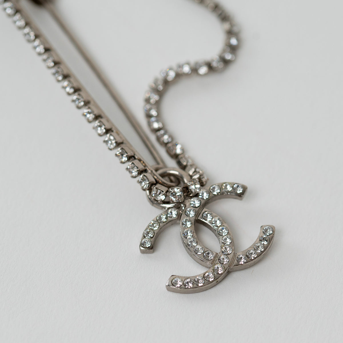 Pre-Loved Chanel™ Silver Tone Crystal Embellished Safety Pin Double Brooch