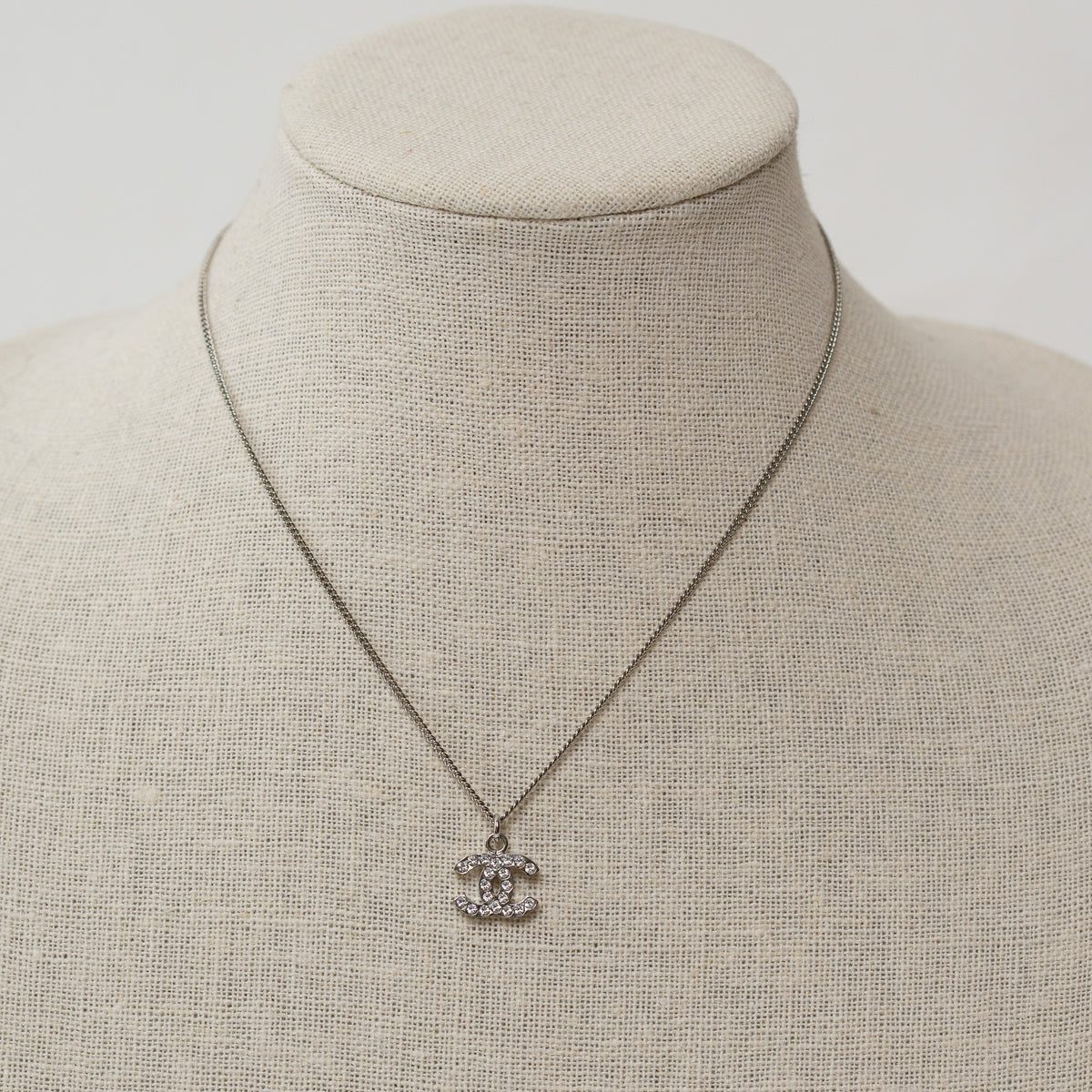 Pre-Loved Chanel™ Silver Crystal Embellished Logo Necklace