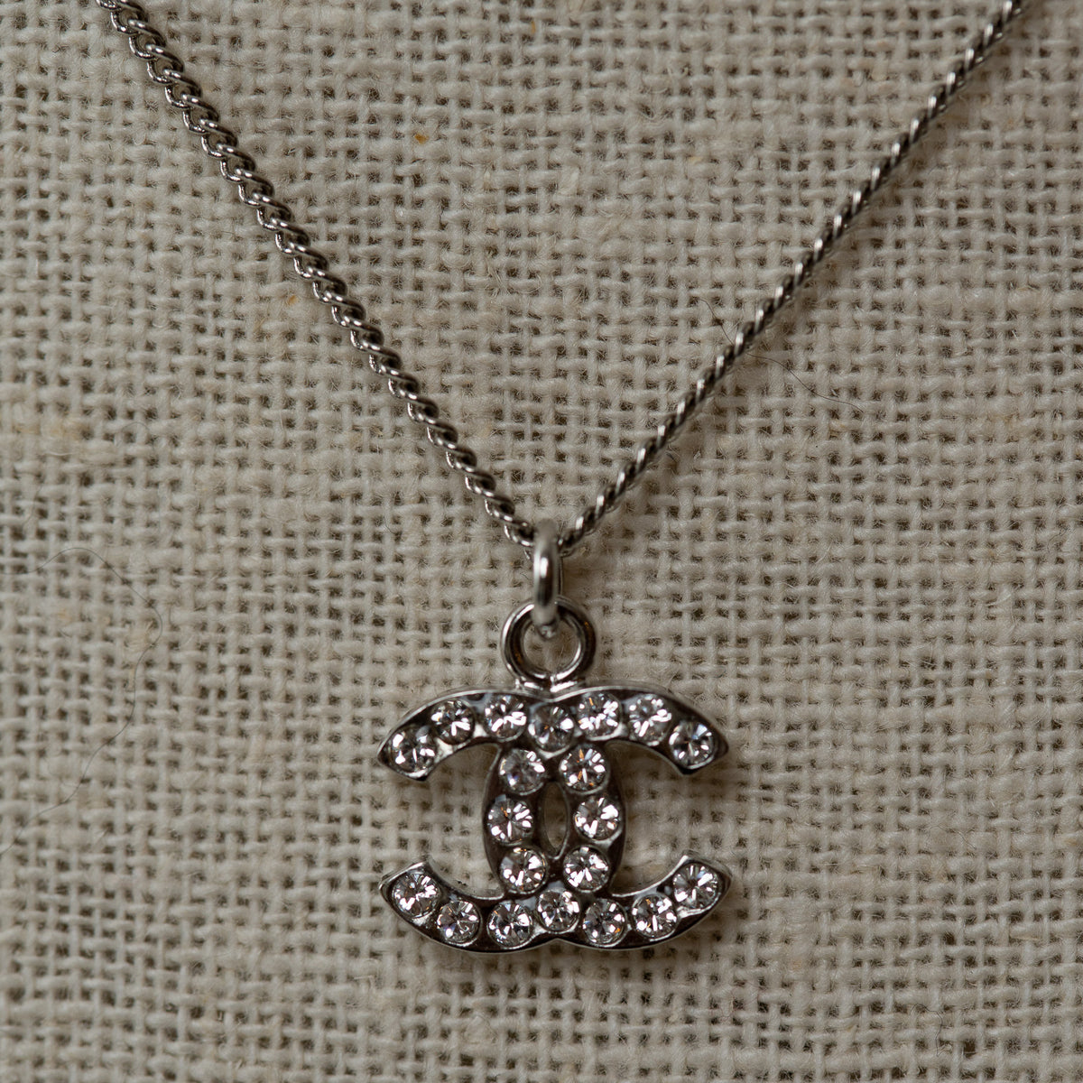 Pre-Loved Chanel™ Silver Crystal Embellished Logo Necklace
