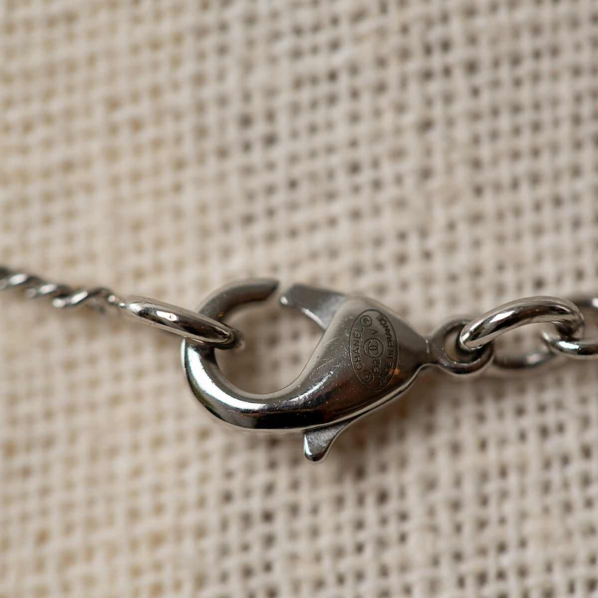 Pre-Loved Chanel™ Silver Crystal Embellished Logo Necklace