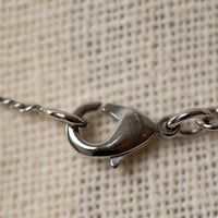 Pre-Loved Chanel™ Silver Crystal Embellished Logo Necklace