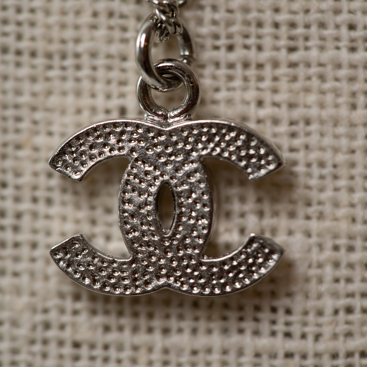 Pre-Loved Chanel™ Silver Crystal Embellished Logo Necklace