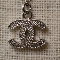 Pre-Loved Chanel™ Silver Crystal Embellished Logo Necklace