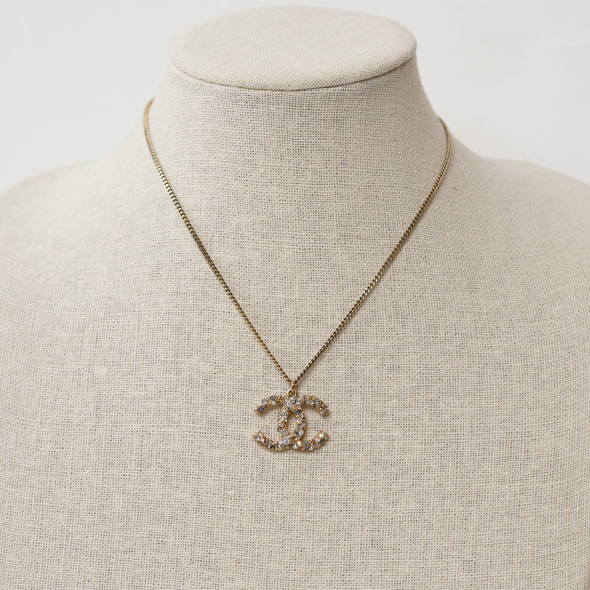 Pre-Loved Chanel™ Gold Two Tone Crystal Embellished Pendant Logo Necklace