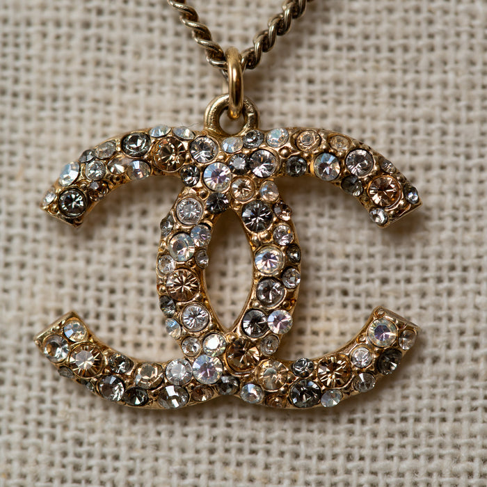 Pre-Loved Chanel™ Gold Two Tone Crystal Embellished Pendant Logo Necklace