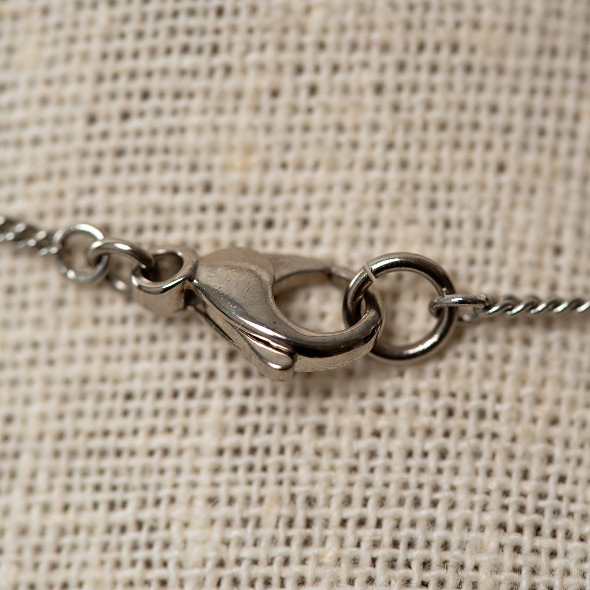 Pre-Loved Chanel™ Silver Tone Necklace with Double Interlocking Logo Pendant