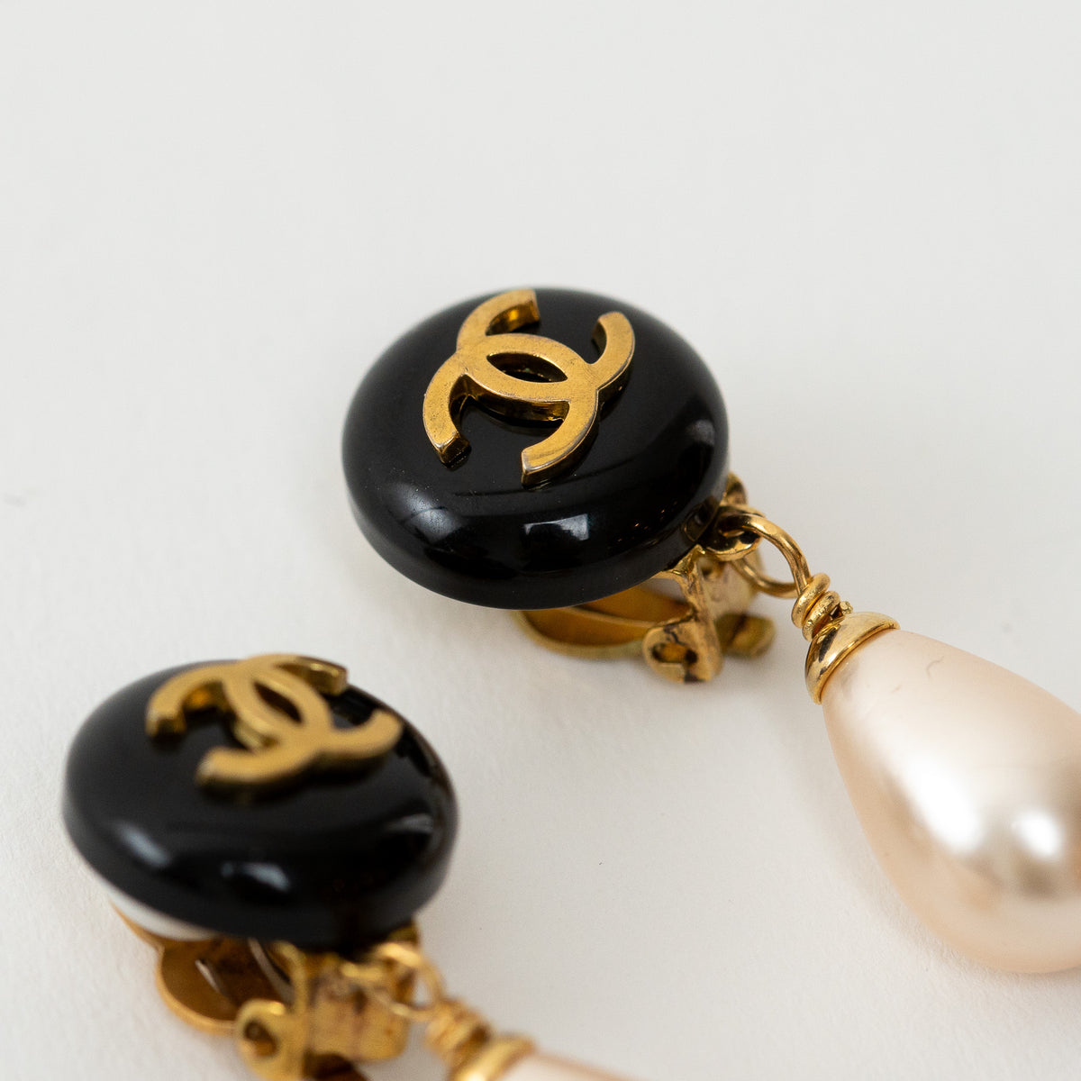 Pre-Loved Chanel™ Gold Logo Black Enamel Faux Pearl Drop Clip on Earrings