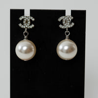 Pre-Loved Chanel™ Silver Tone Mini Crystal Embellished Logo Faux Pearl Drop Earrings