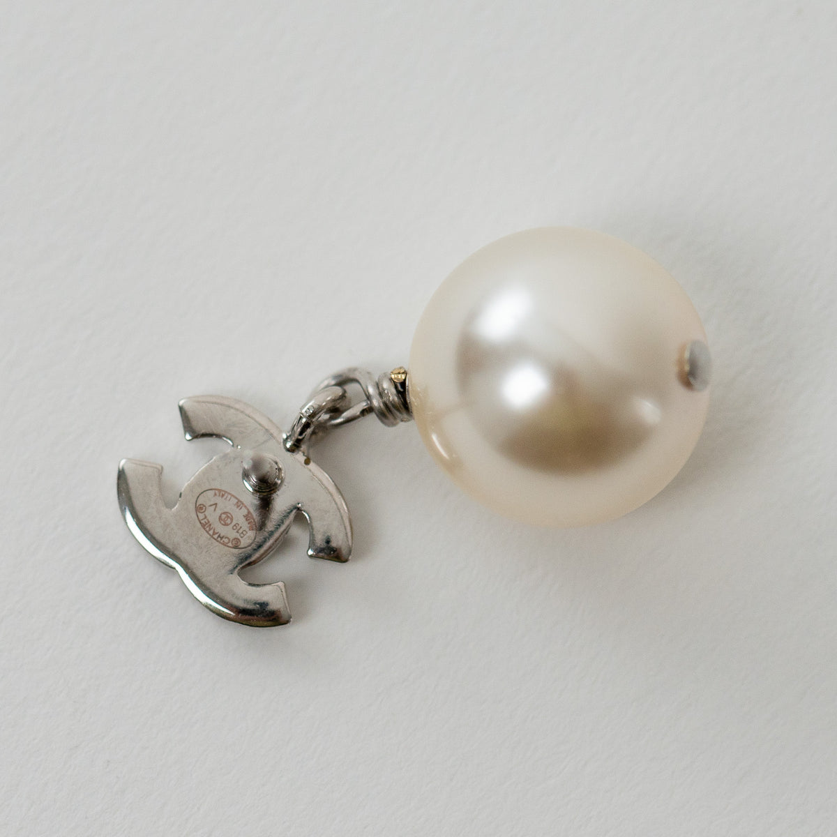 Pre-Loved Chanel™ Silver Tone Mini Crystal Embellished Logo Faux Pearl Drop Earrings