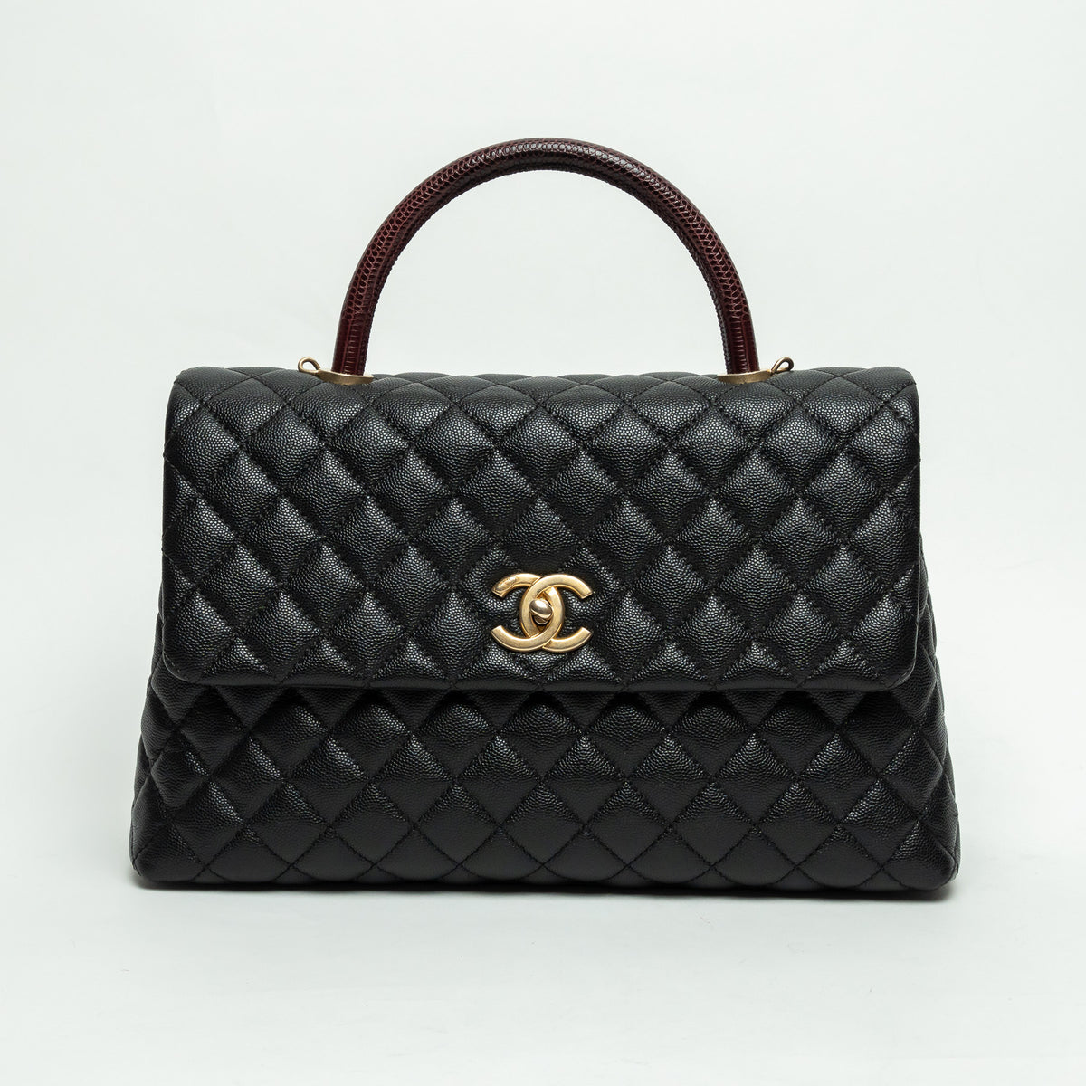 Pre-Loved Chanel™ Black Pebbled Leather Medium Coco Handle Bag with Burgundy Lizard Leather Handle