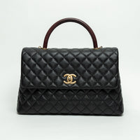 Pre-Loved Chanel™ Black Pebbled Leather Medium Coco Handle Bag with Burgundy Lizard Leather Handle
