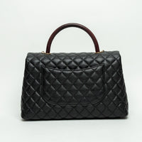 Pre-Loved Chanel™ Black Pebbled Leather Medium Coco Handle Bag with Burgundy Lizard Leather Handle
