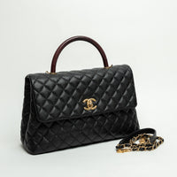 Pre-Loved Chanel™ Black Pebbled Leather Medium Coco Handle Bag with Burgundy Lizard Leather Handle