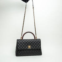 Pre-Loved Chanel™ Black Pebbled Leather Medium Coco Handle Bag with Burgundy Lizard Leather Handle