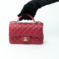 Pre-Loved Chanel™ Pink Raspberry Lambskin Leather Mini Top Handle Bag