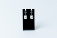 silver tone logo earrings with tear drop pearls (front)