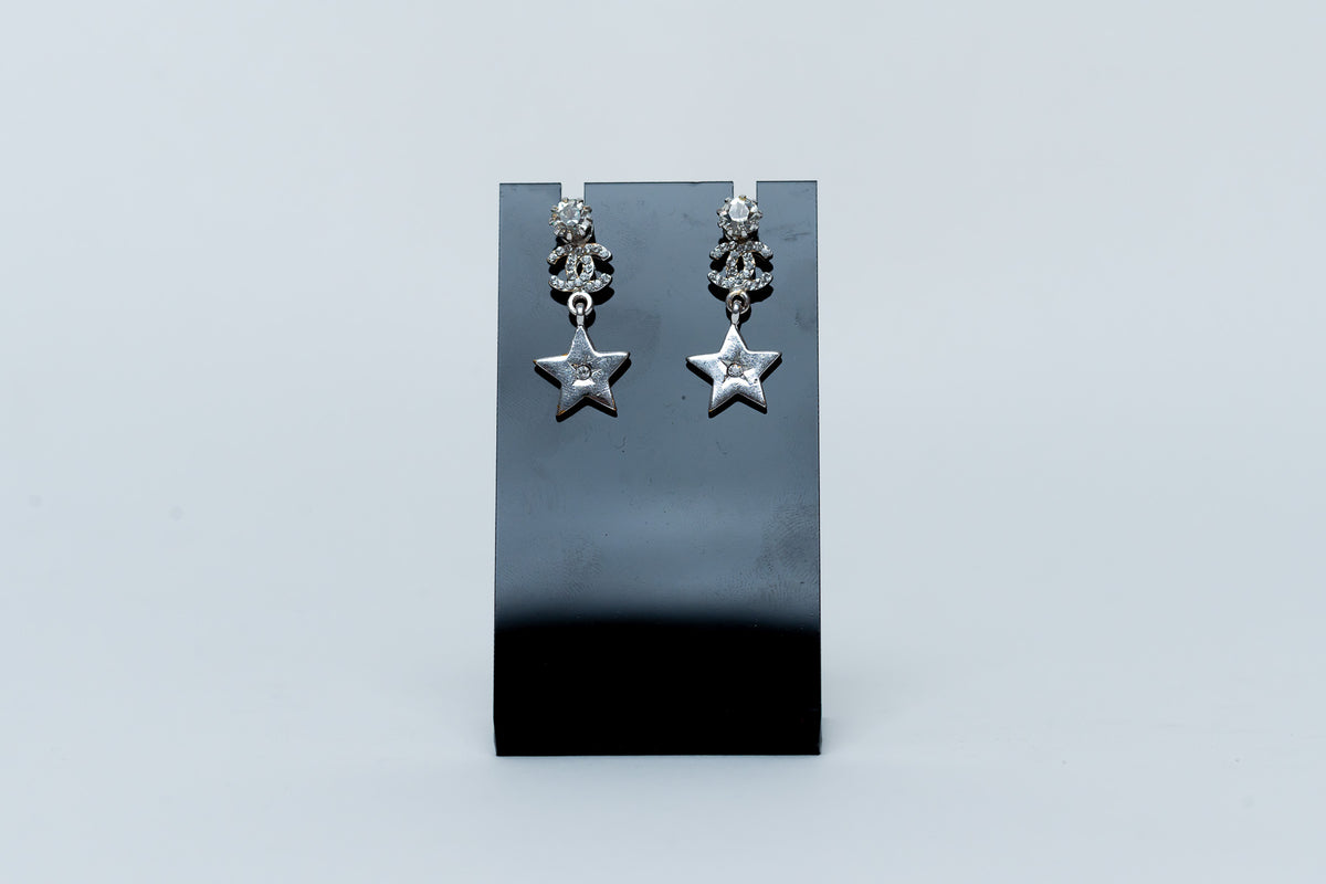 silver tone star drop earrings with crystal embellished logo (front)
