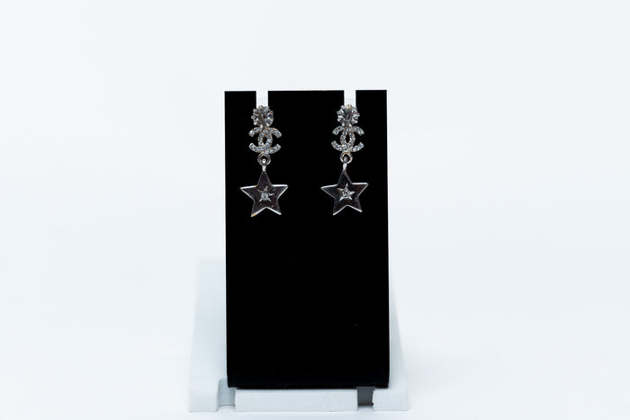 silver tone star drop earrings with crystal embellished logo (front)