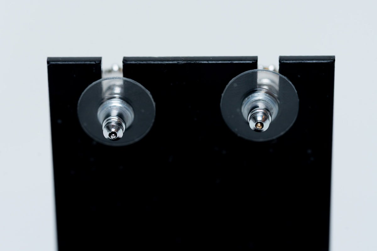 silver tone star drop earrings with crystal embellished logo (back)