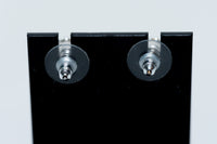 silver tone star drop earrings with crystal embellished logo (back)