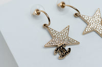 star and logo drop earrings (close up)