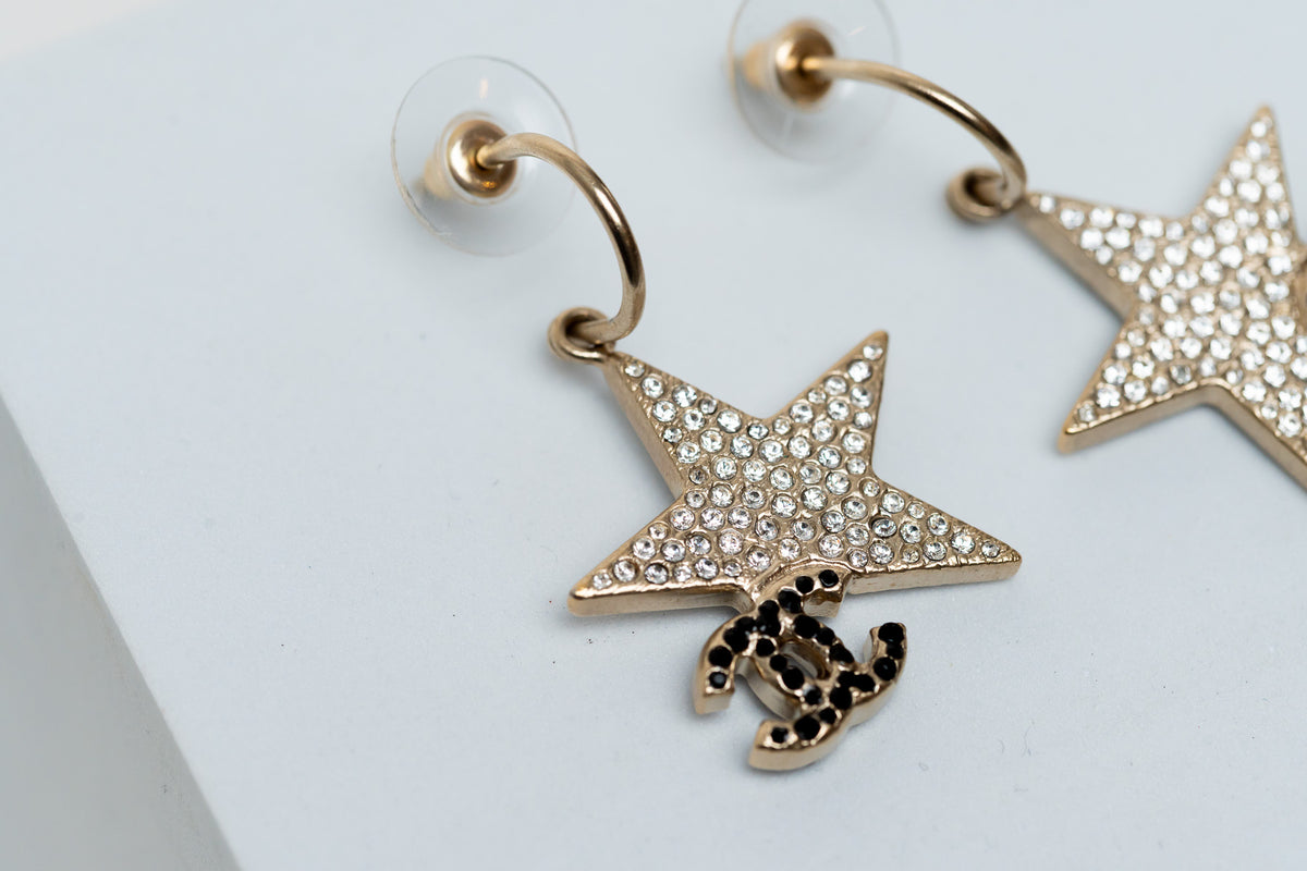 star and logo drop earrings (close up)