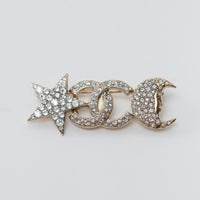 Chanel Gold Star and Moon Brooch with Crystal Embellishments