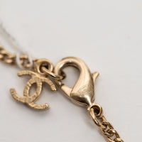 Pre-Loved Chanel™ Gold Tone Logo Pendant Necklace Inset with Clear and Black Crystals