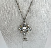 Excellent Pre-Loved Silver Tone Metal with White and Light Yellow Crystal Embellished Floral Pendant Drop Necklace. (close up)