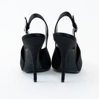 Saint Laurent Black satin high-heeled shoes on a white background