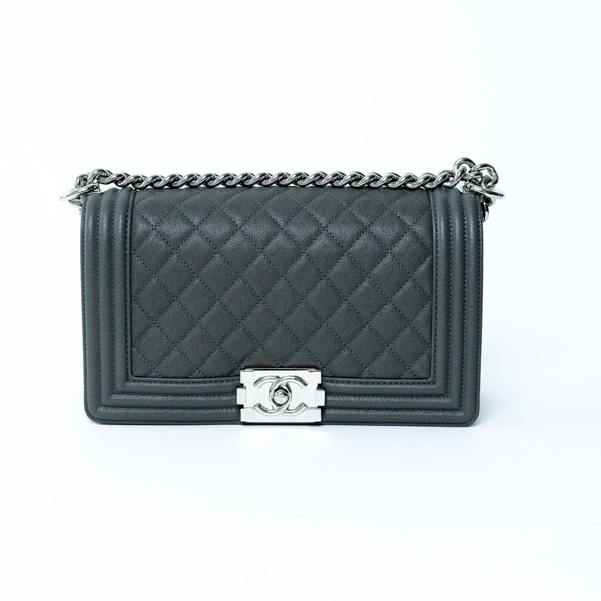 Chanel Medium Boy Bag in Grey quilted handbag with a silver chain and clasp on a white background