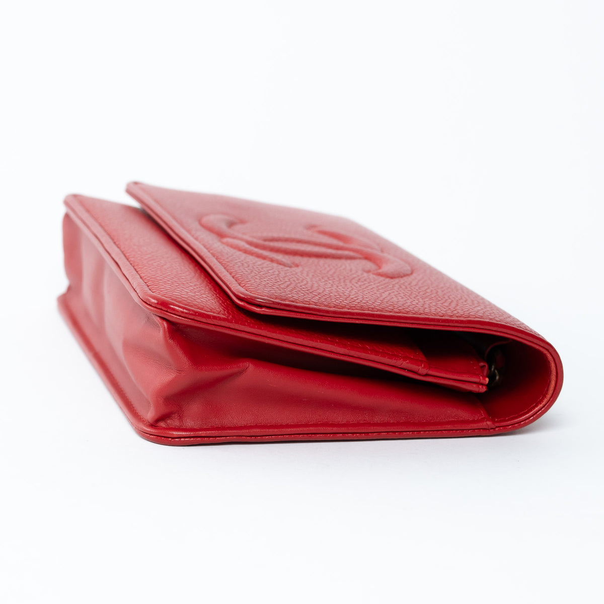 Pre-loved Chanel red leather wallet  with chain on a white background