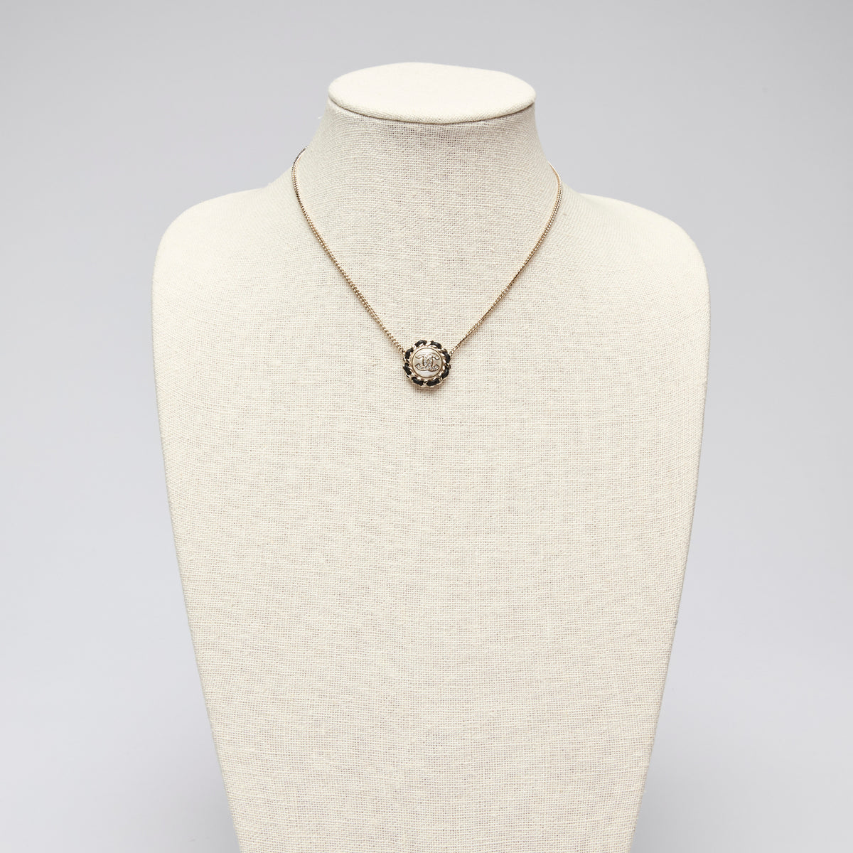 Pre-Loved Chanel™ Gold Tone Interlocking Letter Logo Pendant Necklace.