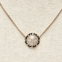 Pre-Loved Chanel™ Gold Tone Interlocking Letter Logo Pendant Necklace.