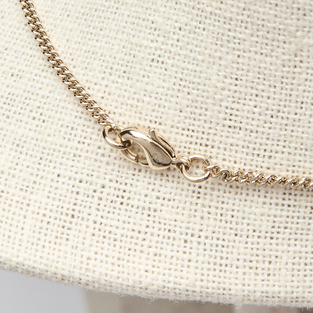 Pre-Loved Chanel™ Gold Tone Interlocking Letter Logo Pendant Necklace.