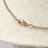 Pre-Loved Chanel™ Gold Tone Interlocking Letter Logo Pendant Necklace.