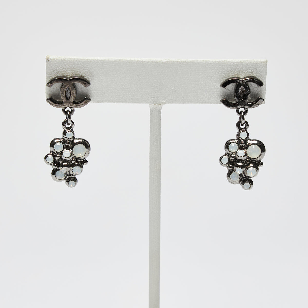 Excellent Pre-Loved Dark Shiny Silver Tone Logo Earrings with Crystal Clustered Drop. (front)