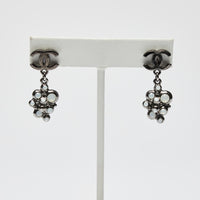 Excellent Pre-Loved Dark Shiny Silver Tone Logo Earrings with Crystal Clustered Drop. (front)