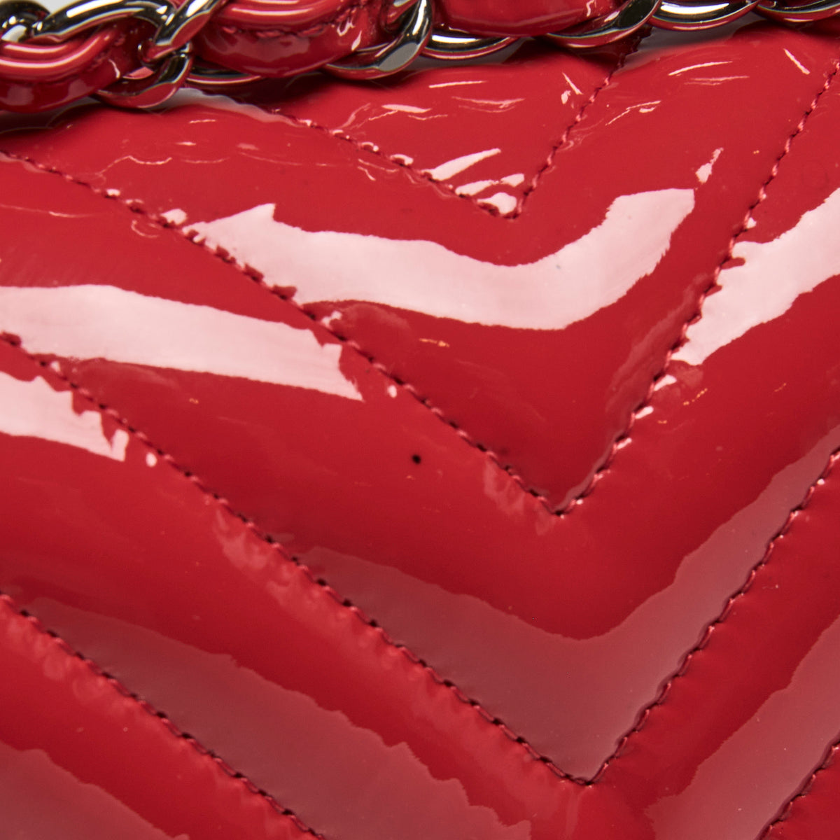 Pre-Loved Chanel™ Red Patent Leather Mini Chevron Flap Handbag