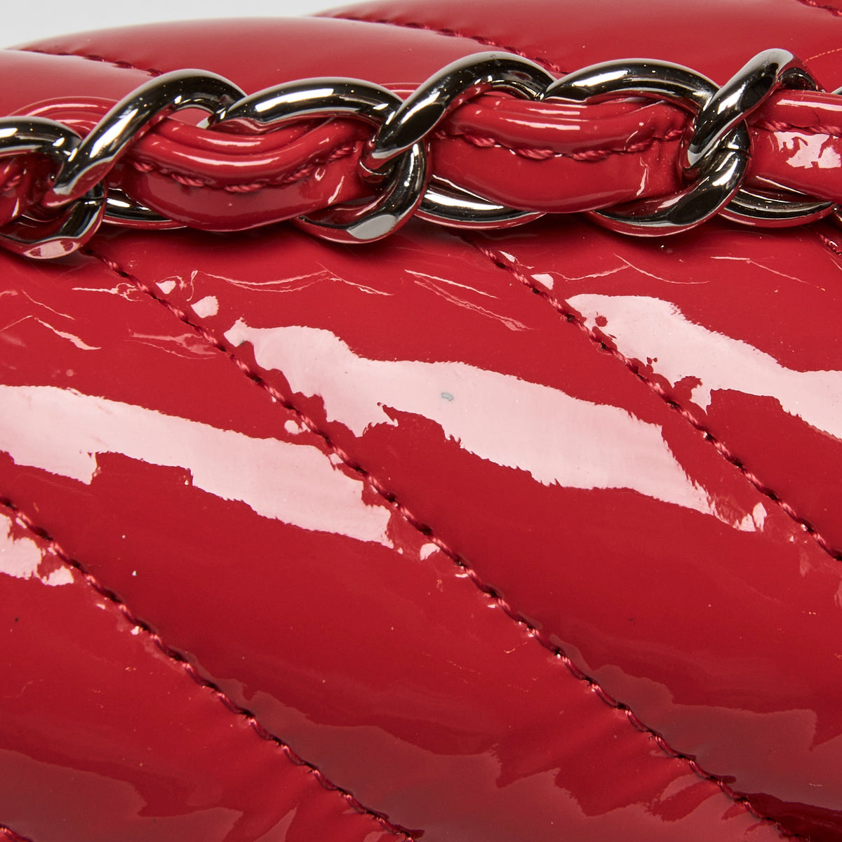 Pre-Loved Chanel™ Red Patent Leather Mini Chevron Flap Handbag