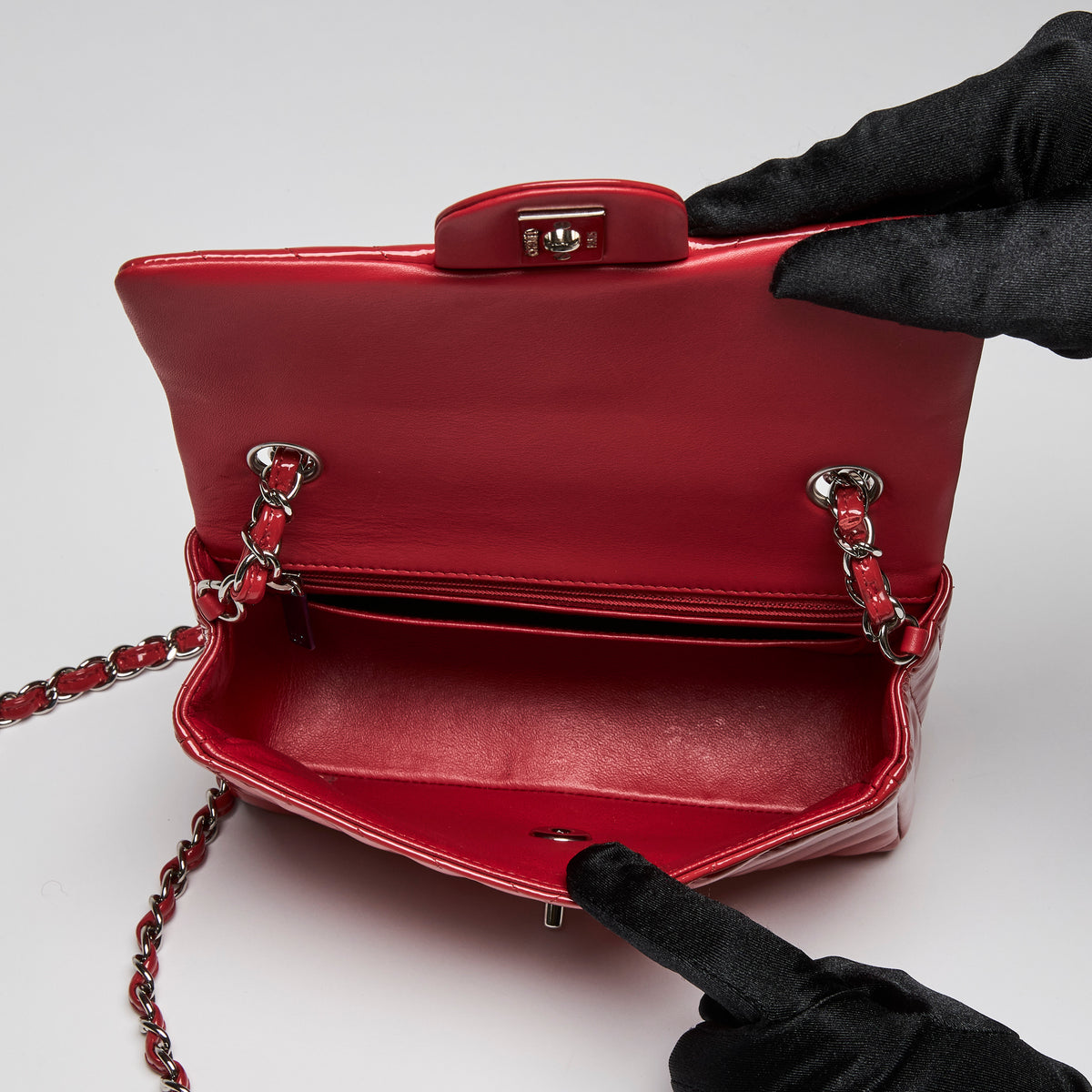 Pre-Loved Chanel™ Red Patent Leather Mini Chevron Flap Handbag