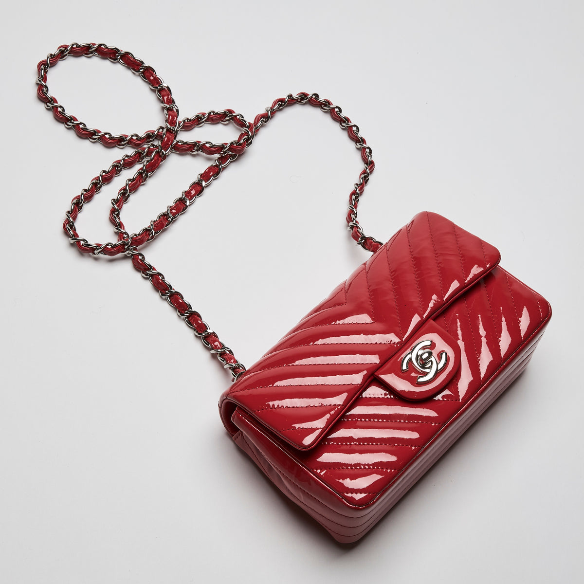 Pre-Loved Chanel™ Red Patent Leather Mini Chevron Flap Handbag